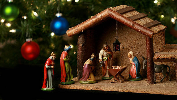 nativity scene with christmas tree background
